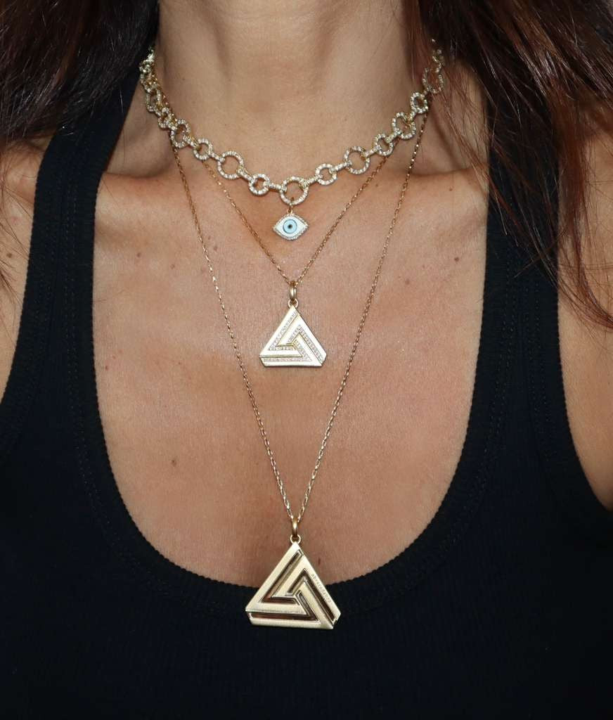 Abracadabra Large and Small Charm Layered for a stylish look with Classic Aaron Basha Pieces.
