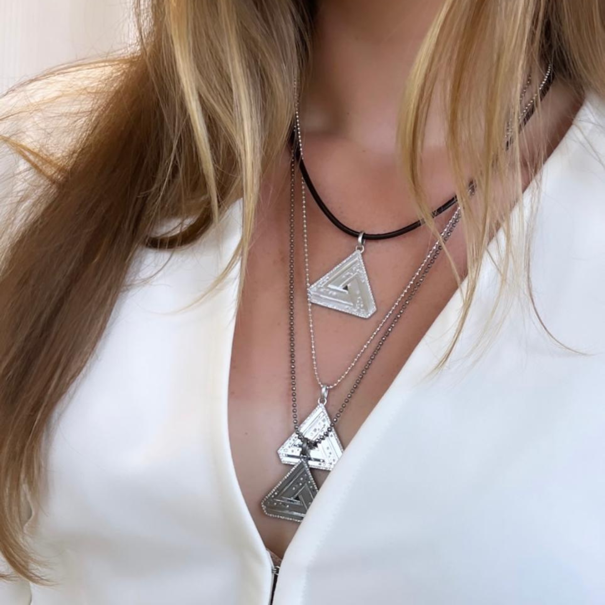 Large Abracadabra Silver Series 5 Layered with Black Rhodium Abracadabra Creating a Timeless Necklace Stack.