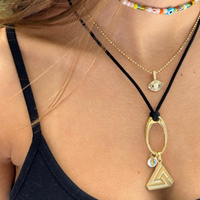 Small Abracadabra Triangle Series 1 Necklace showing countless ways this special and unique charm can be worn.  